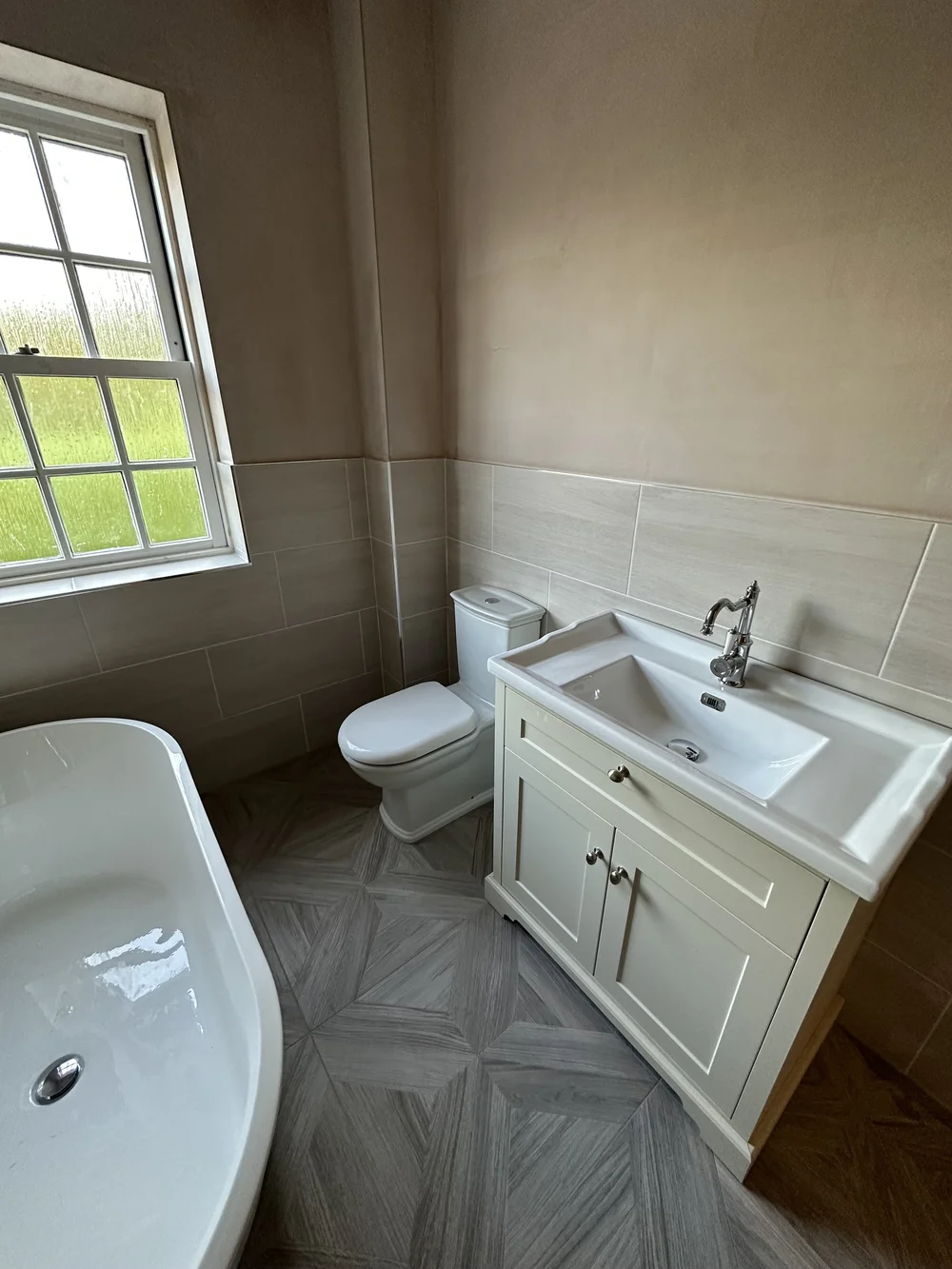Traditional bathroom with cream shaker vanity, chrome tap and parquet floor — bathroom renovation Haslemere